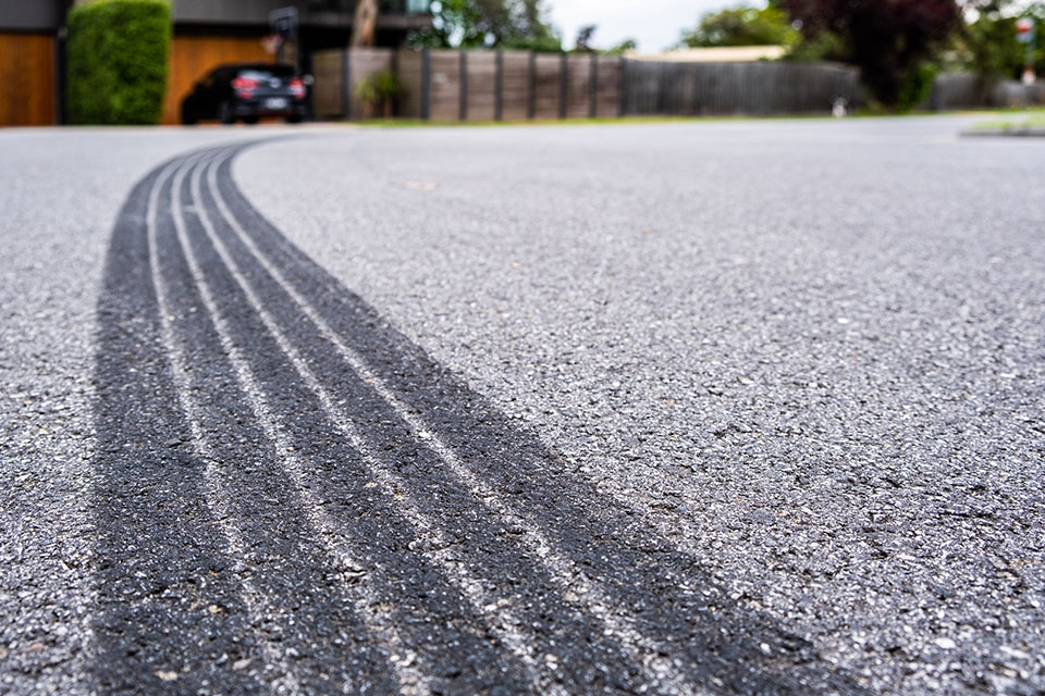 Tyre track on asphalt from hard braking - shallow focus
